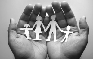 Hands-holding-paper-cutout-family1
